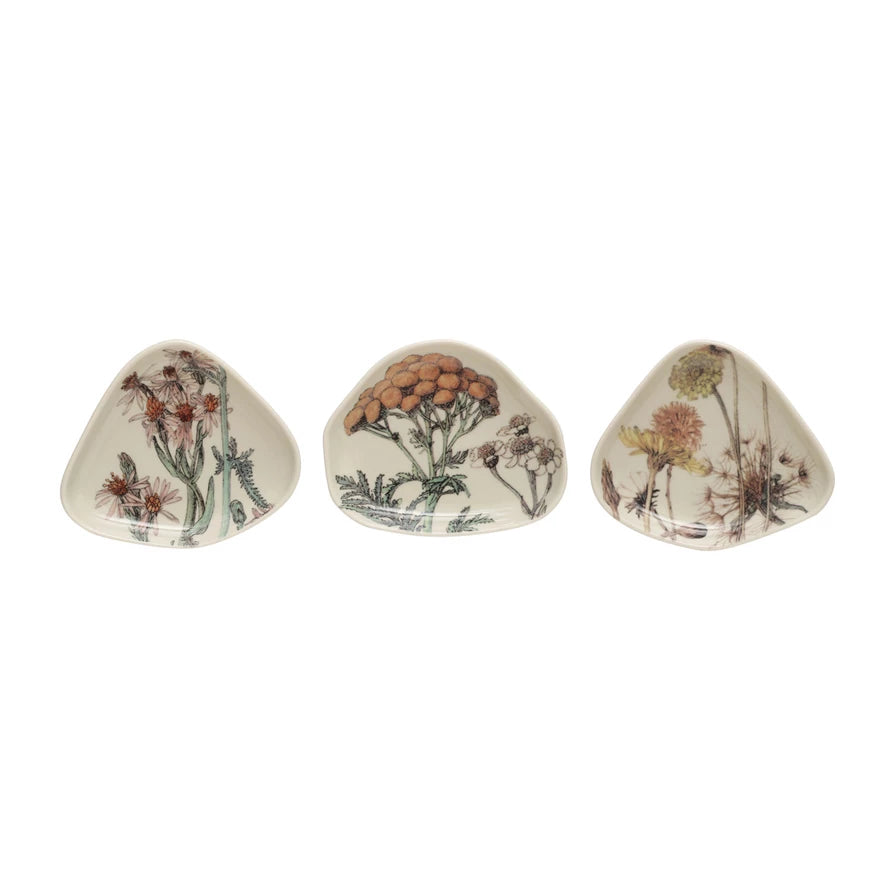 3 floral dishes in a row on a white background