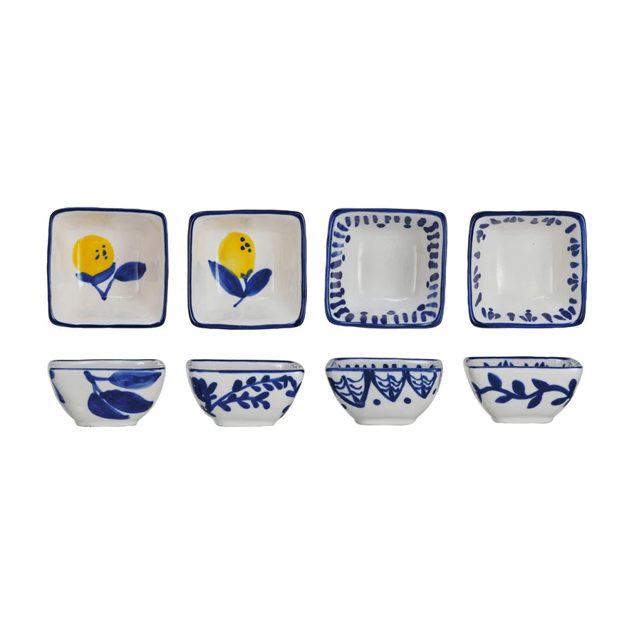 4 assorted blue and white dishes with or without lemon design shown from a top and side view.