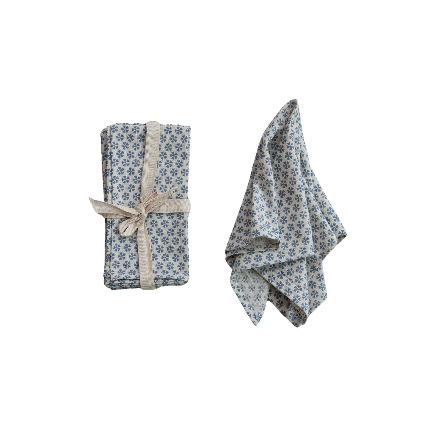 napkin set next to a slightly folded napkin