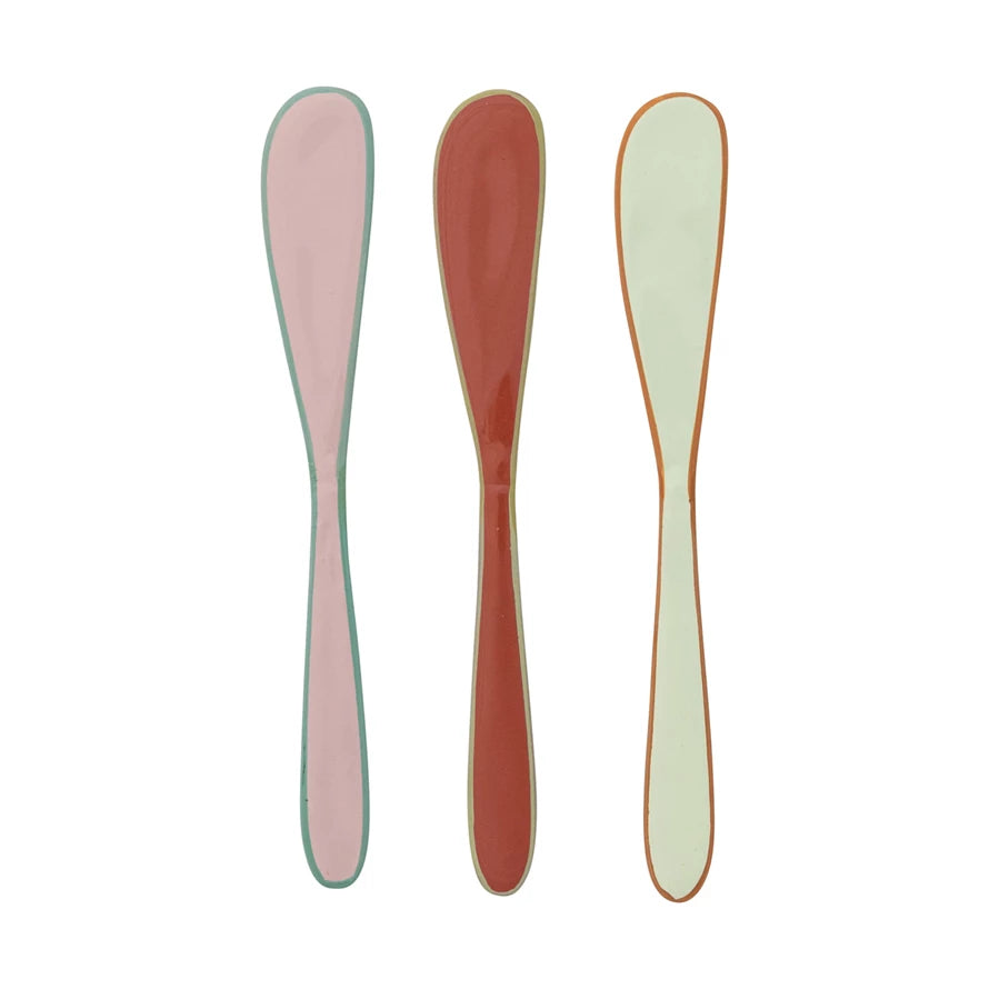 multicolor spreaders in a row on a white background