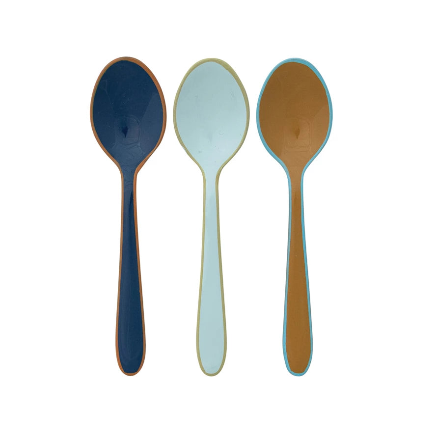 3 colors of Enameled Stainless Steel Spoon with Colored Edge in a row on a white background