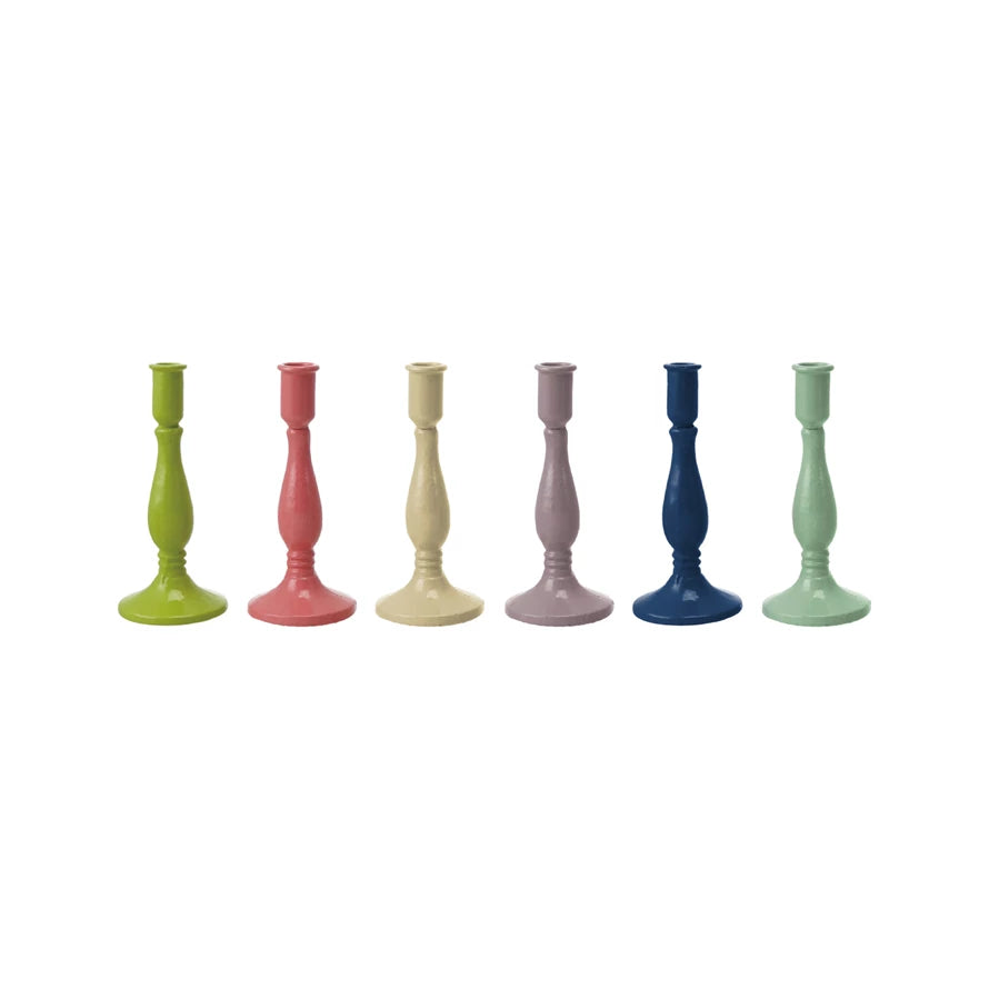 assortment of multicolored candlesticks in a row on a white background.