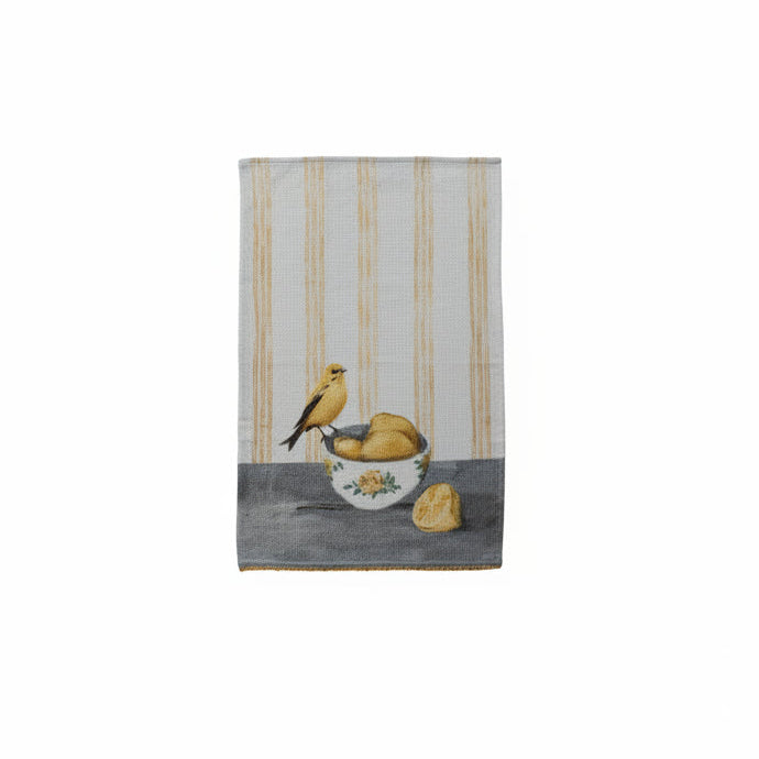 Towel with a design of a yellow bird and bowl of lemons on a yellow striped background