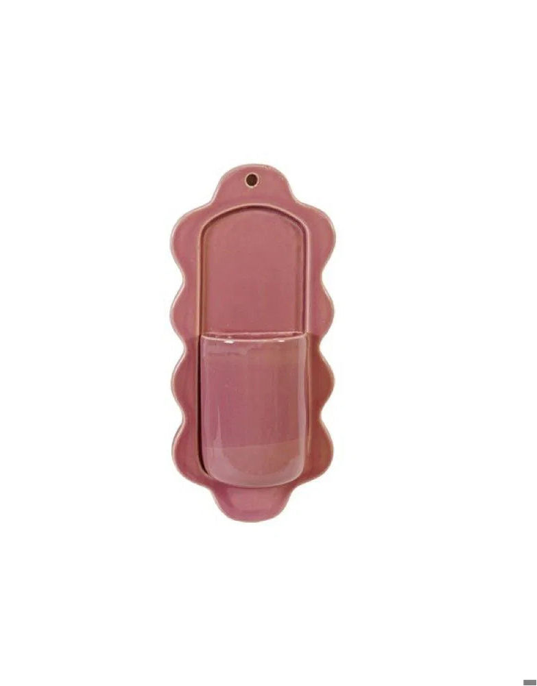 pink ceramic wall pocket shown on a white background