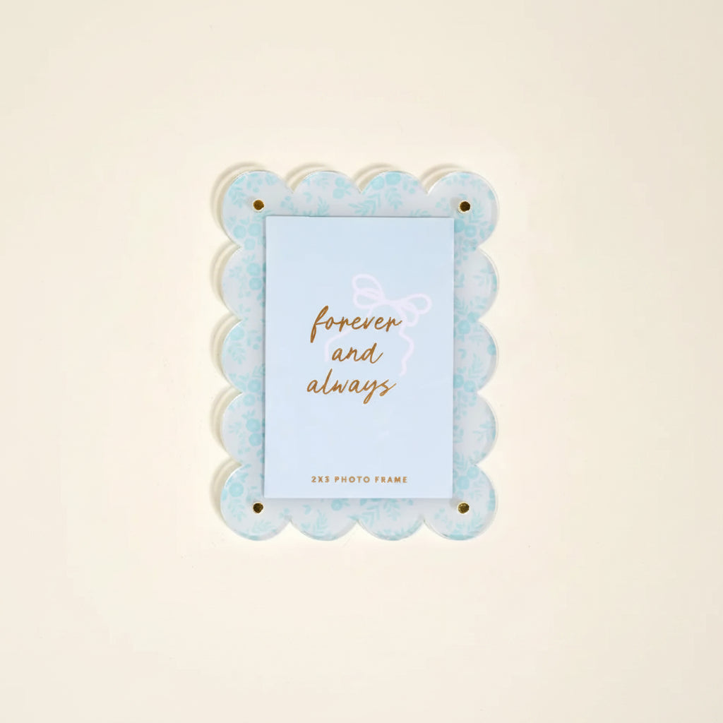 Decorative photo frame with scalloped edge and 'forever and always' insert card shown on a light background