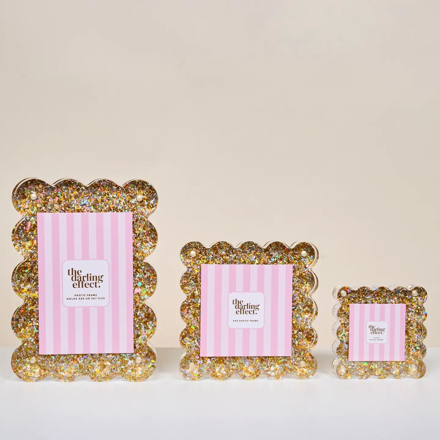 Three sizes decorative picture frames with 'The Darling Effect' branding on a beige background