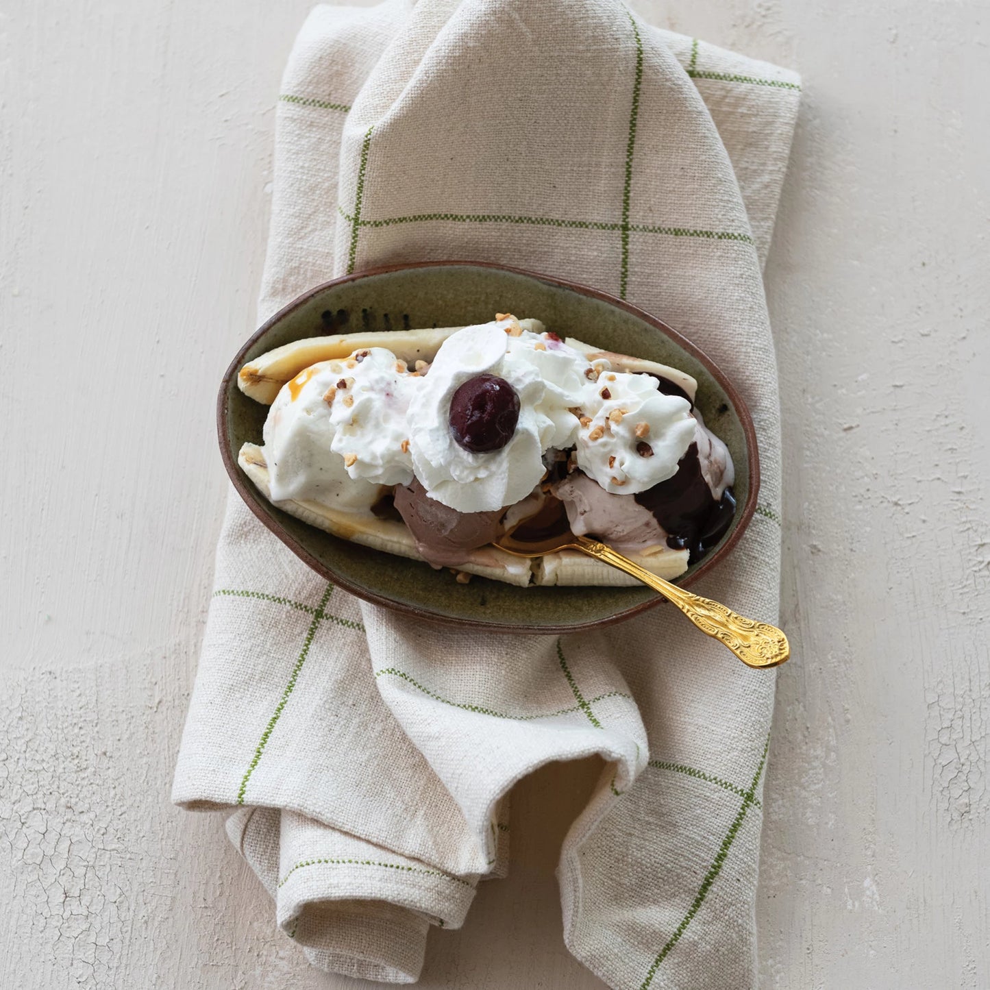 top view of an ice cream sunday topped with Bourbon + Butter Caramel Sauce