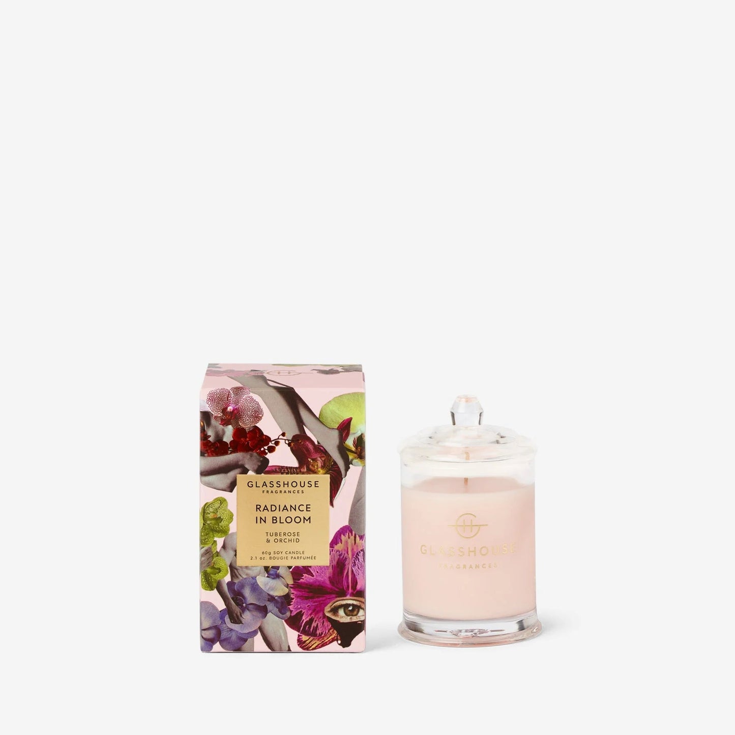 radiance in bloom candle next to is floral packging