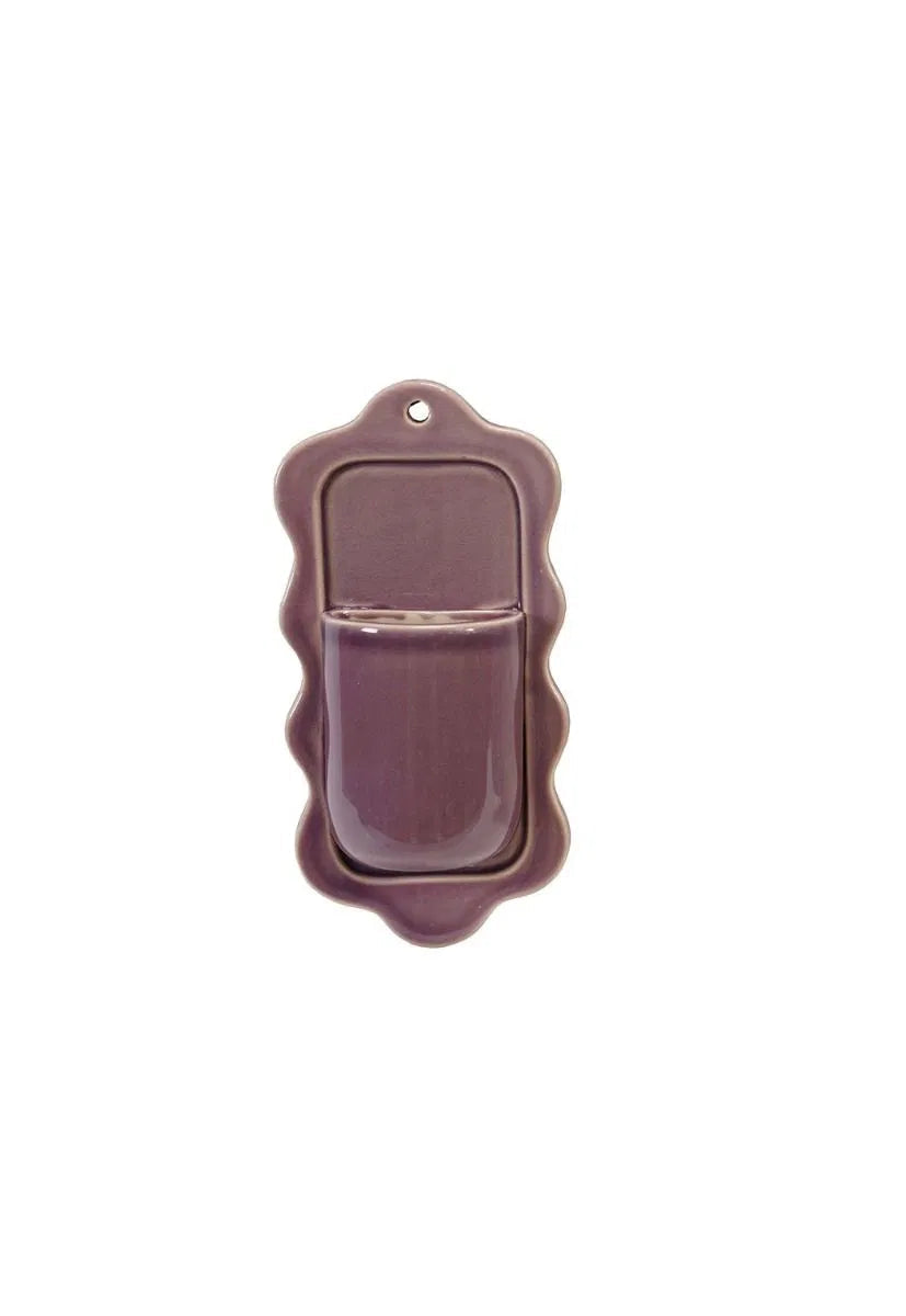 purple stoneware wall pocket with scalloped edges