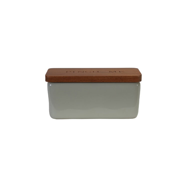 greyish taupe dish with medium toned wood lid