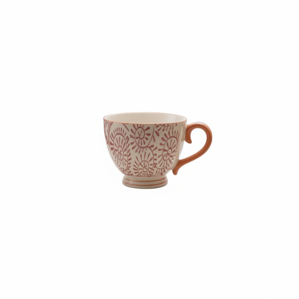 off white mug with purple swirling pattern and mustard handle