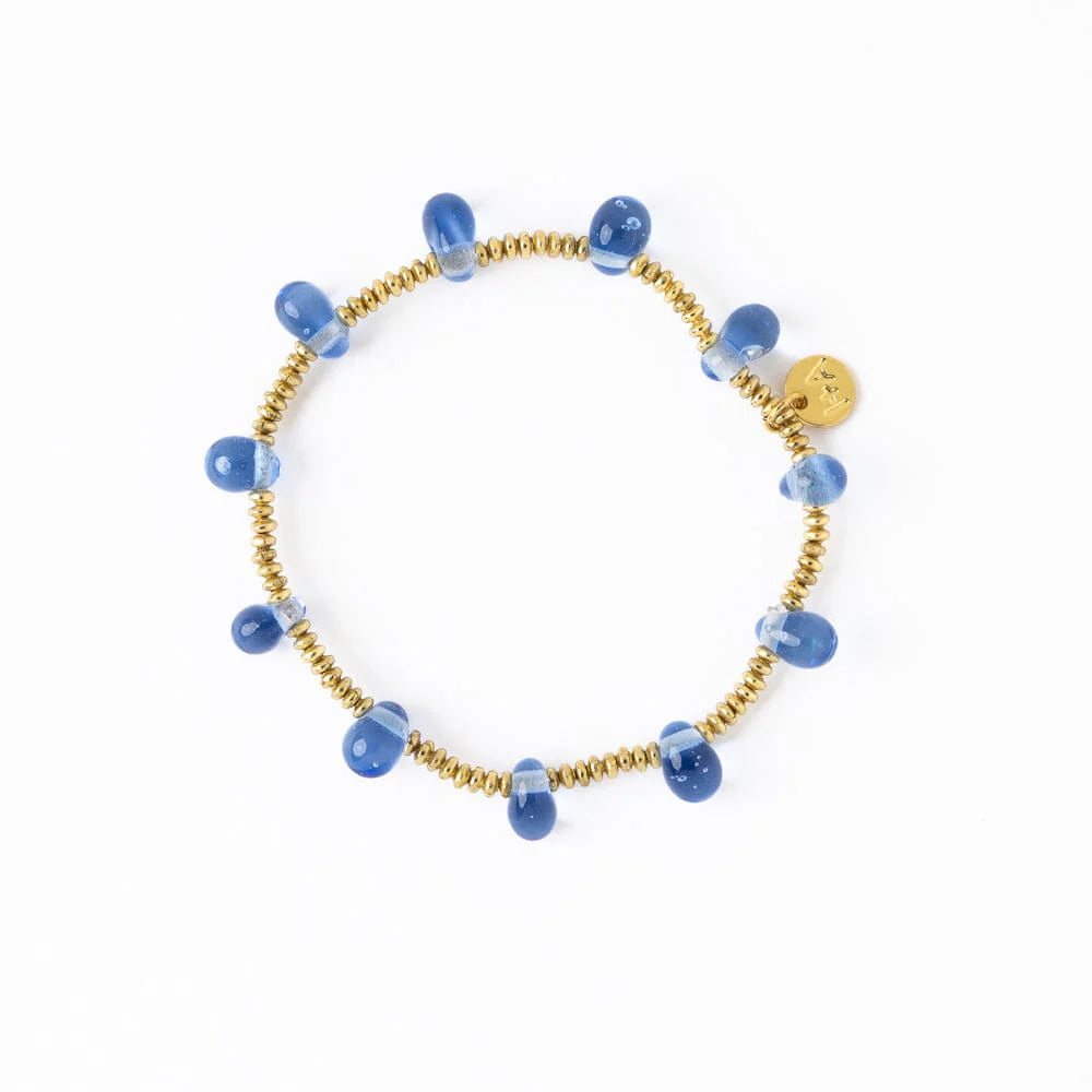 Gold beaded stretch bracelet with light blue teardrop shaped glass beads.