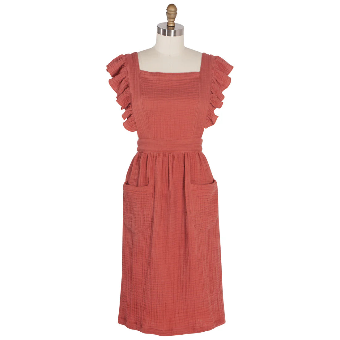 orange apron on a mannquin.