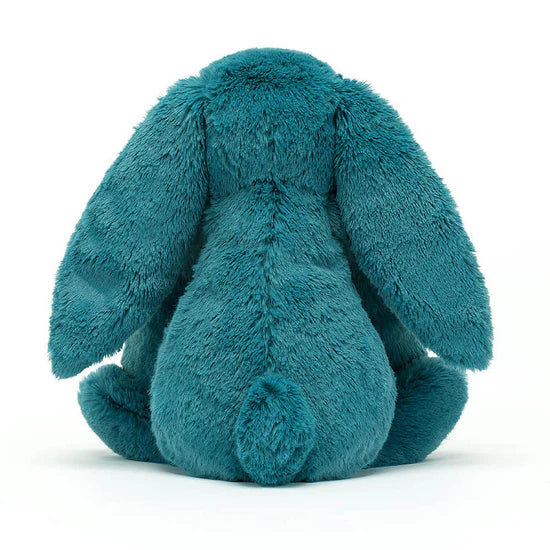 back view of Bashful Teal Bunny Plush Toy sitting on a white background