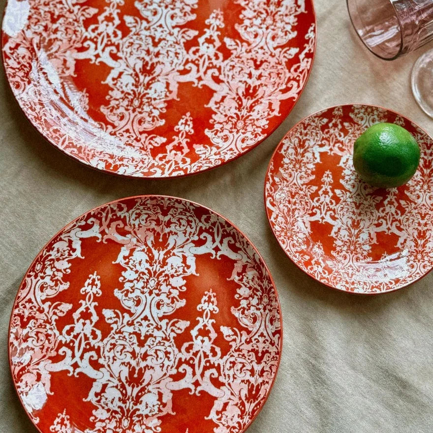 chantal plates arranged on a table with a taupe linen table cloth.