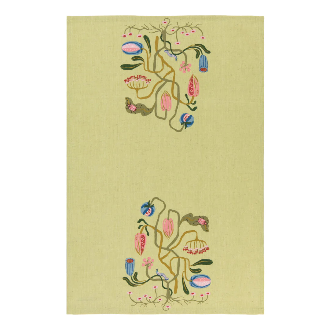 green dishtowel with floral design in the center of the top and bottom