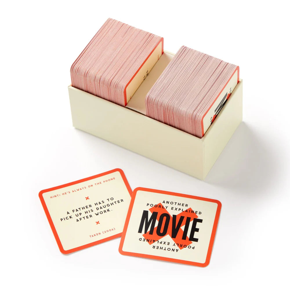 open box of Poorly Explained Movies game showing cards in the box with 2 cards laying next to it.