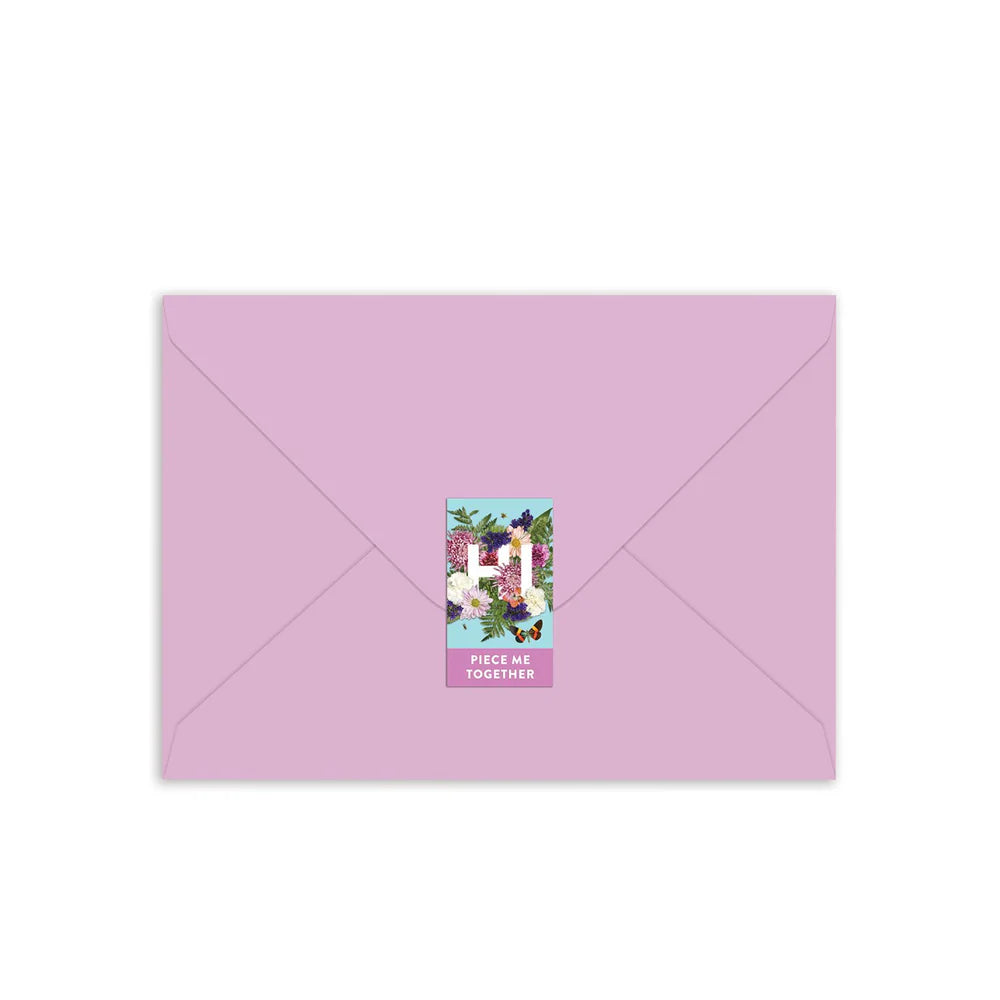 lavender envelope sealed with a sticker.