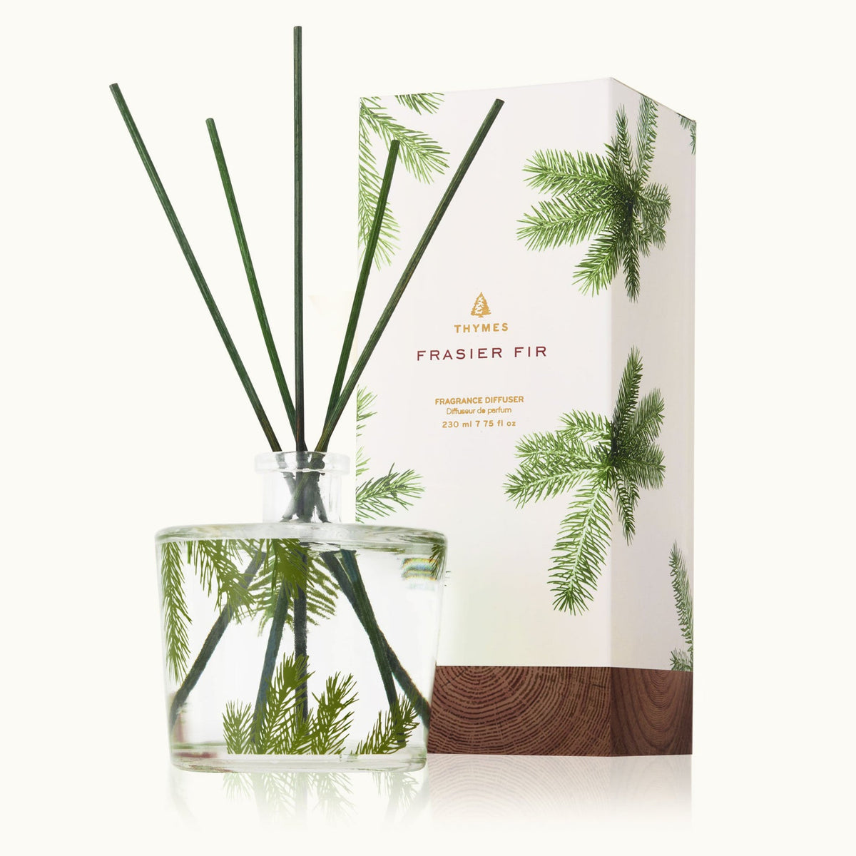 thymes fraiser fir reed diffuser in front of its box on a white background