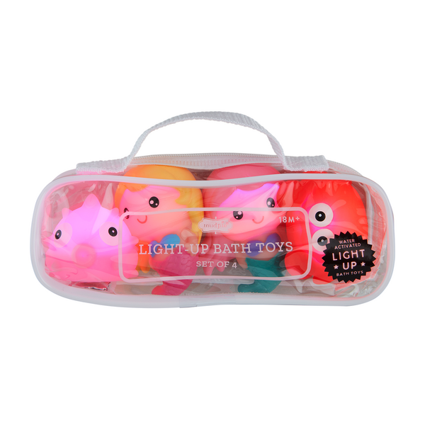 Light-Up Mermaid Bath Toy Set lit up in its bag