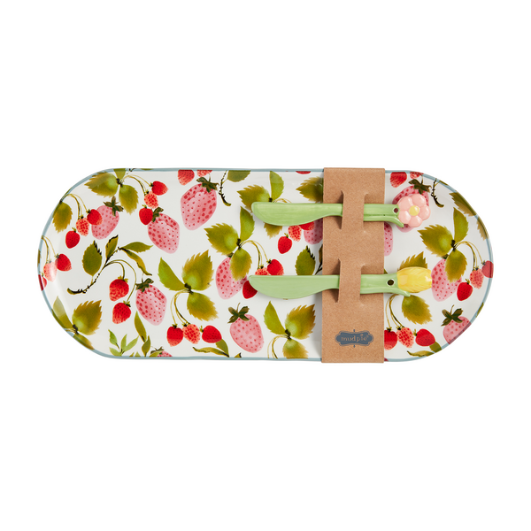 rectangular tray with rounded corners and all-over strawberry design with 2 spreaders attached to it with a paper band.