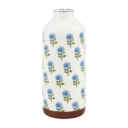 large white vase with pattern of blue flowers on green stems.