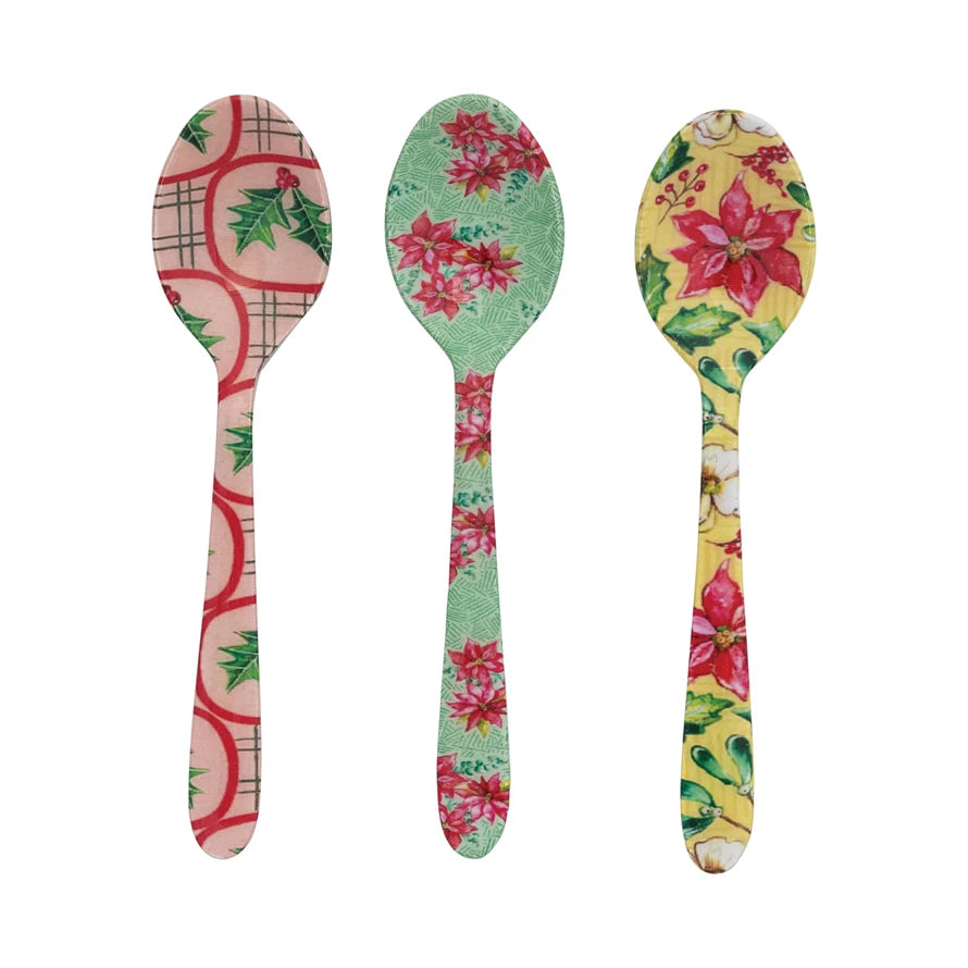 3 assorted Enameled Holiday Botanical Spoon in a row on a white background