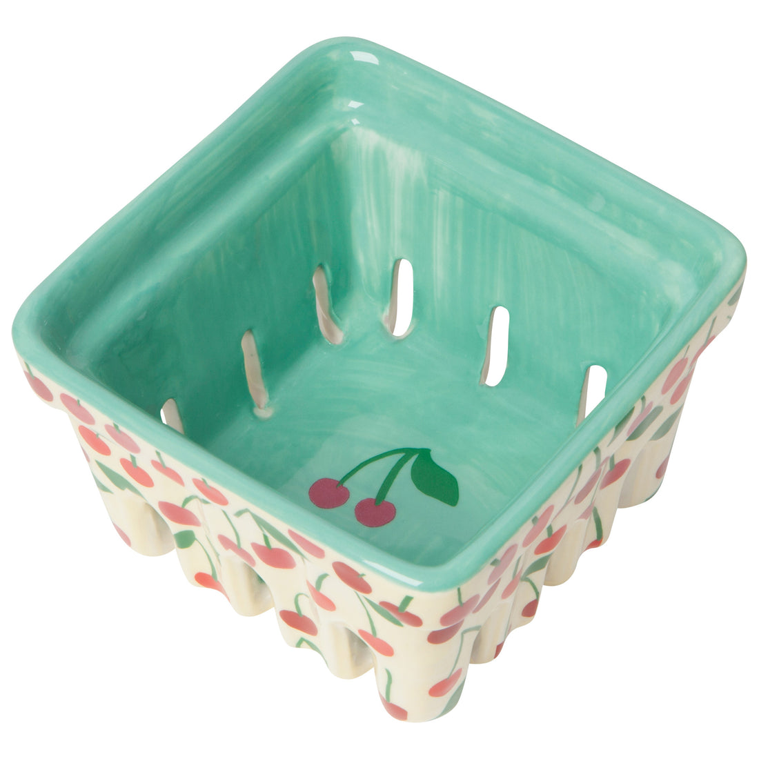 angled view of the cream berry basket with red cherries images on the outside of the basket and a cherry image in the center of the basket