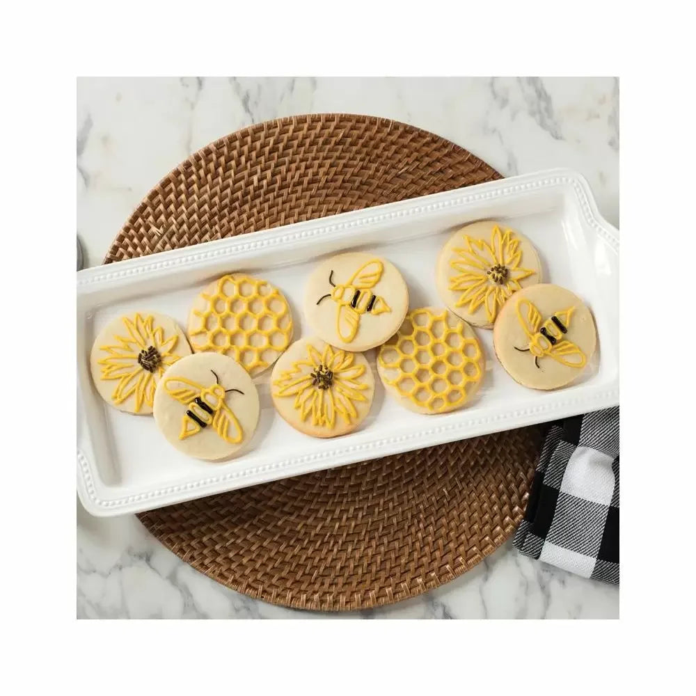 tray of stamped cookies with icing.