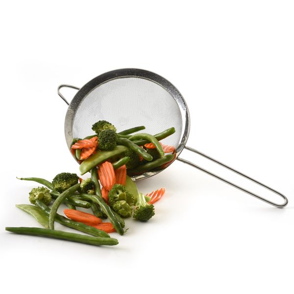 mesh strainer with veggies in it.