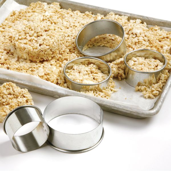 round cutters set with a pan of rice crispy treats that have been cut into circles.