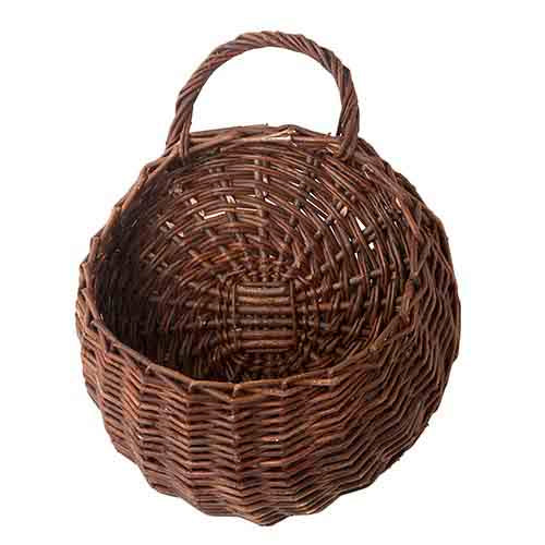 round rattan wall basket with pocket and handle.