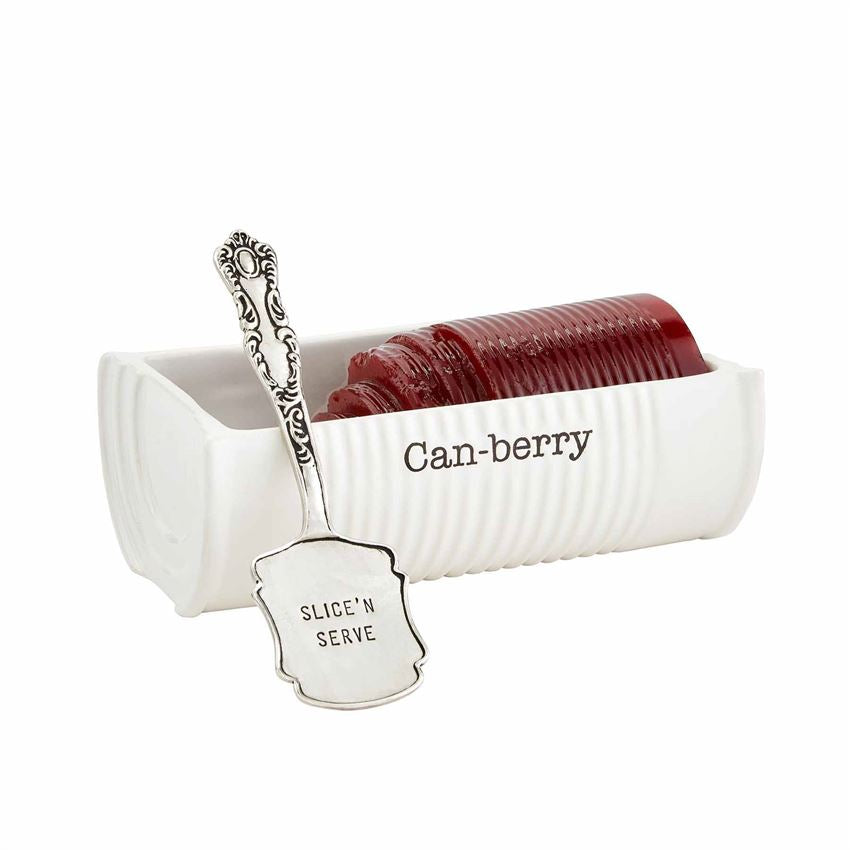 side view of can-berry dish filled with canned cranberry with server.