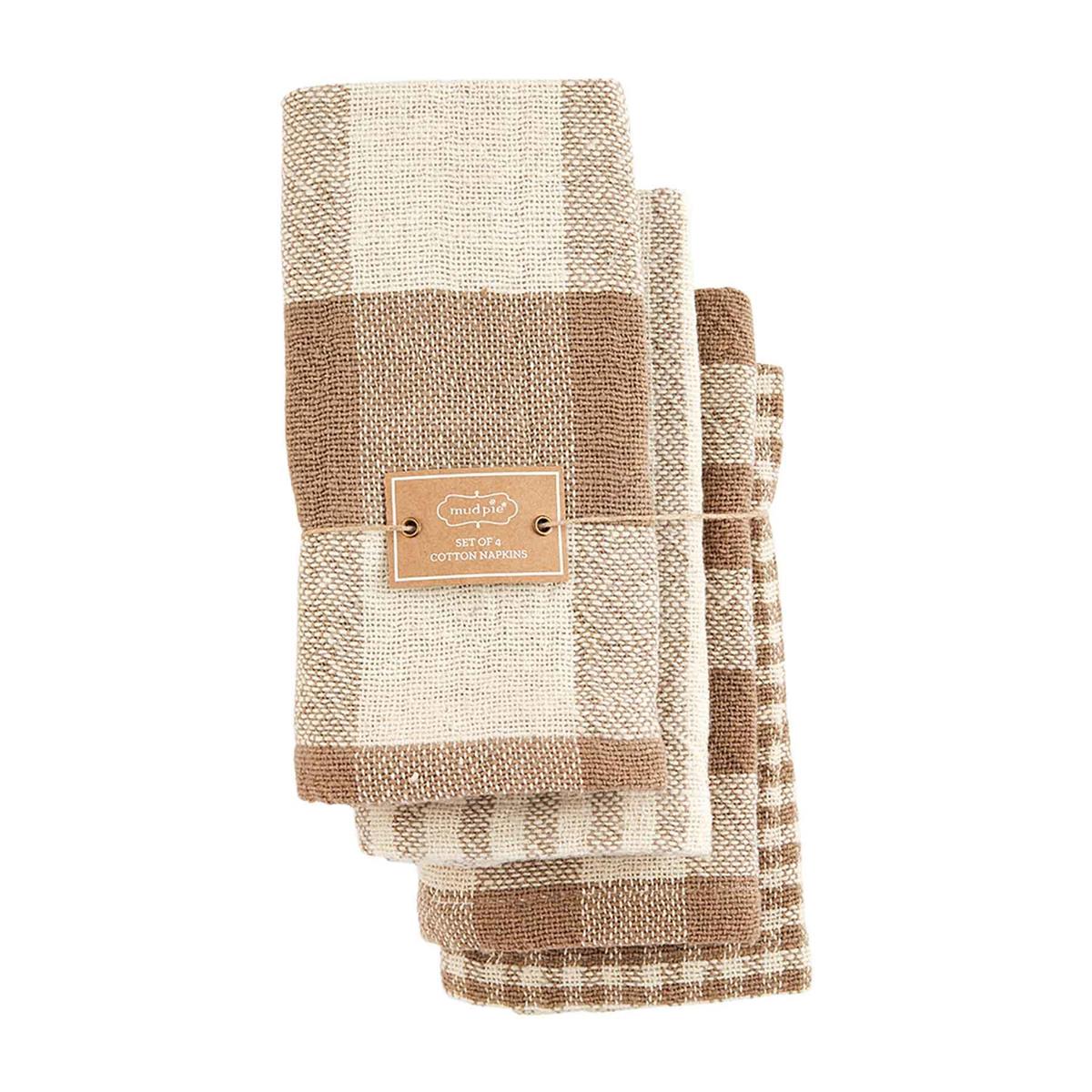 all four mixed pattern napkin set wrapped in twine on a white background