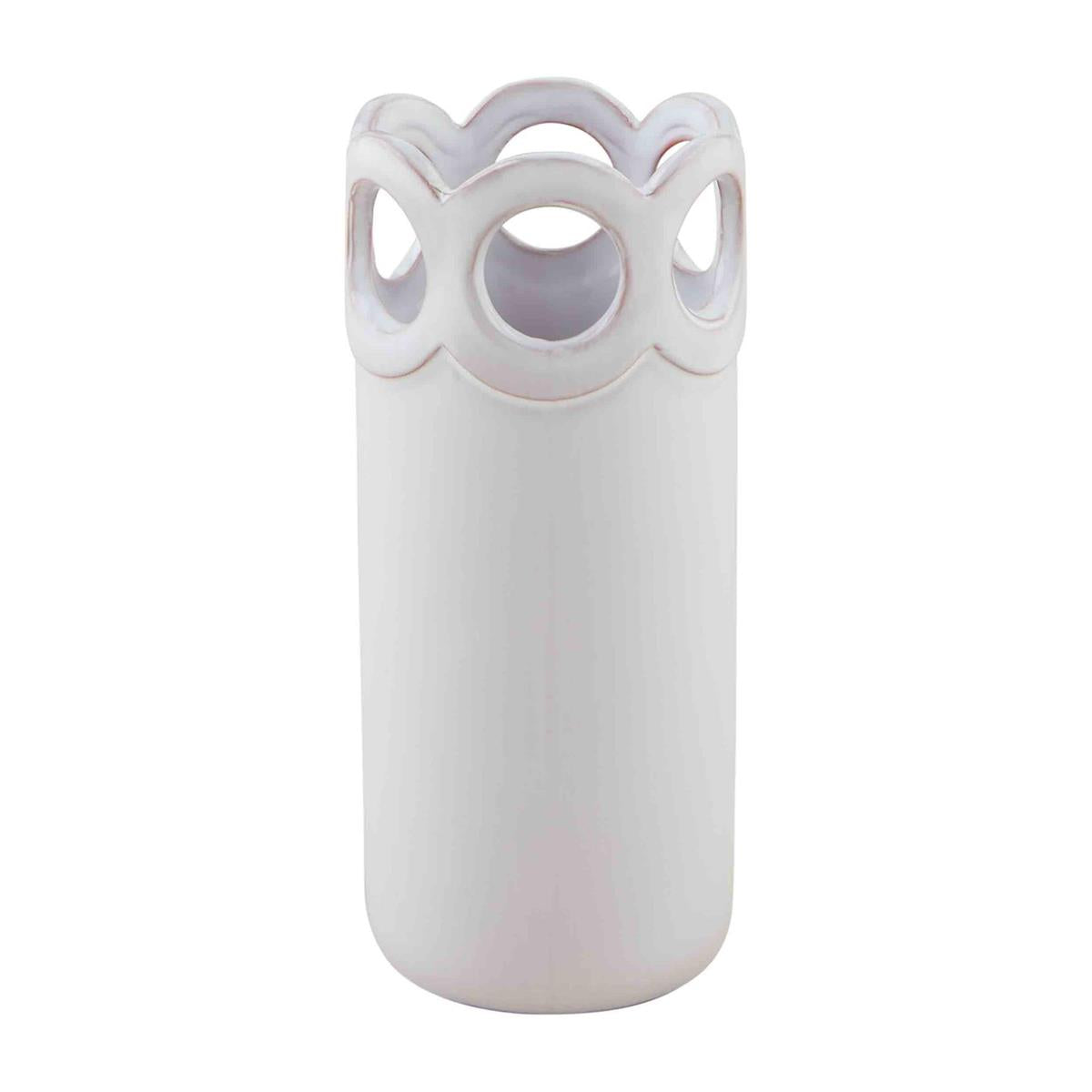 large scalloped bud vase on a white background