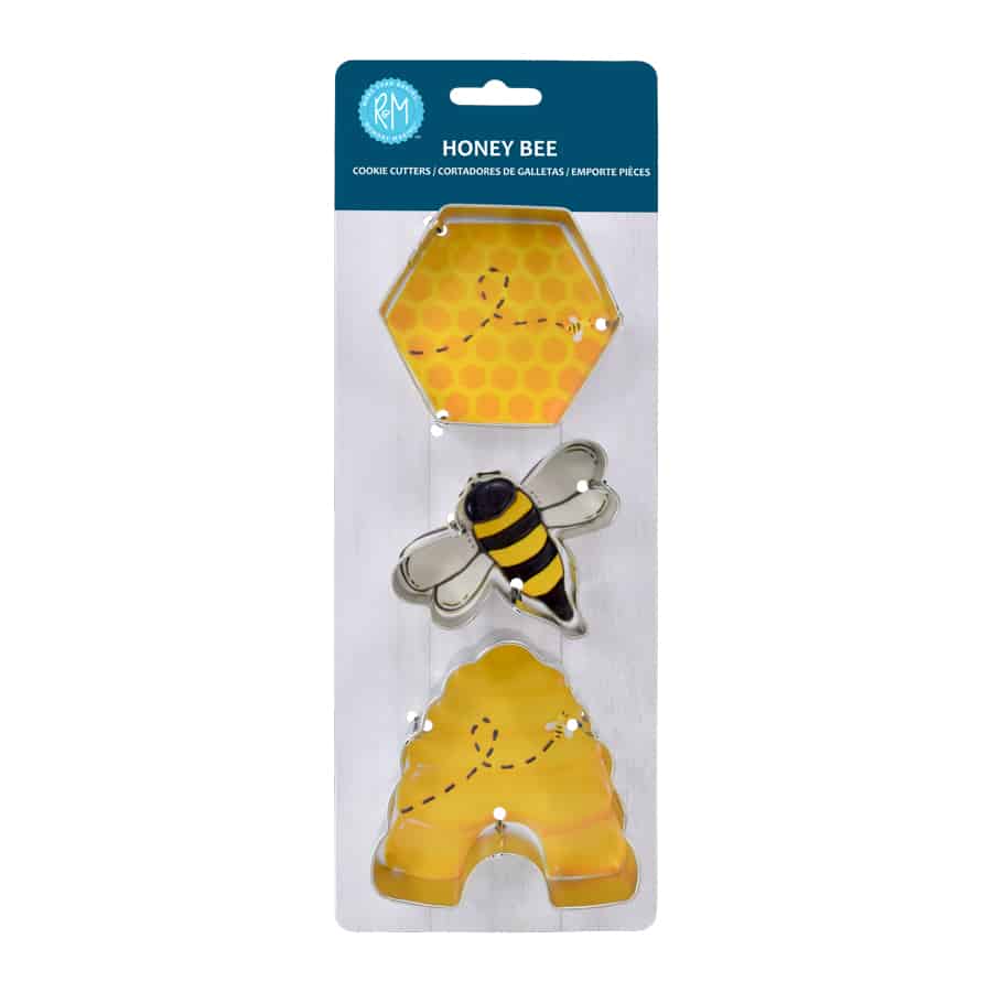 3 cookie cutter: hexagon, bee, and hive on cardboard packaging.