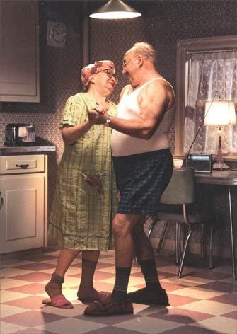 front of card has old picture of on older couple dancing in their robe and boxers in the kitchen