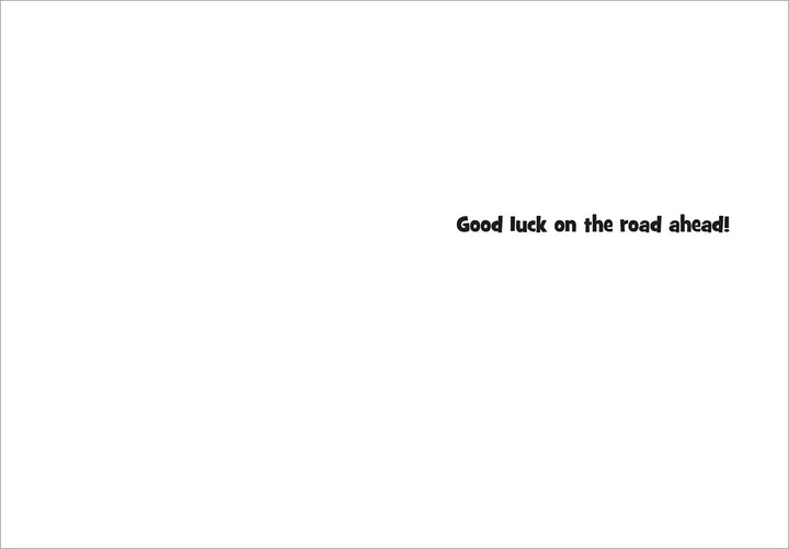 inside card is white with text in black "good luck on the road ahead"