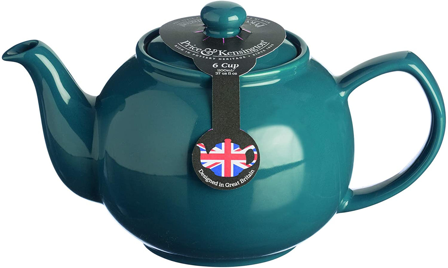 close-up on teapot with packaging label on it on white background.