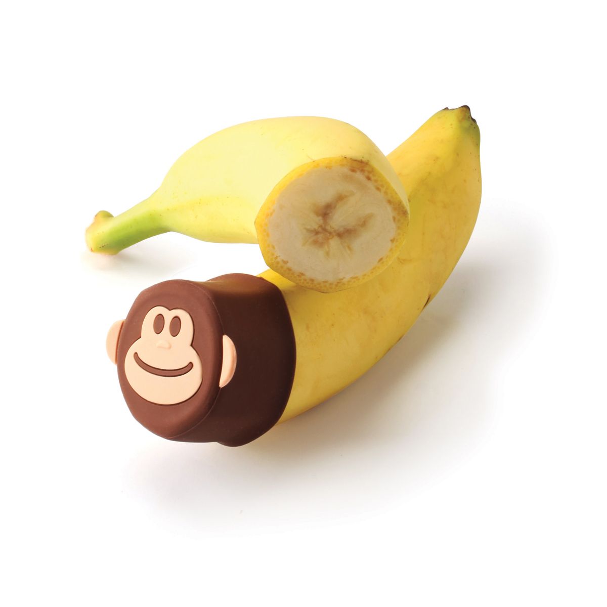 one of the monkey stretch lids displayed on a cut banana on a white background