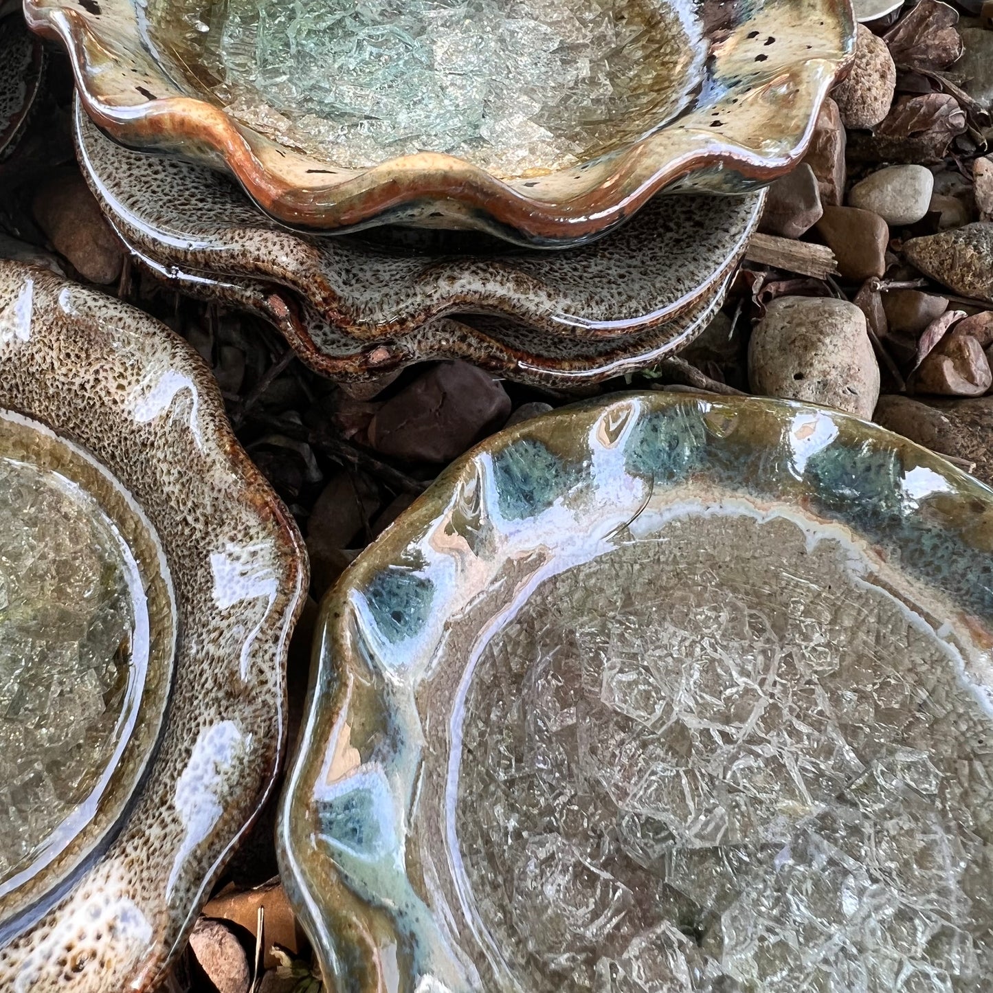 dreamy browns crackled glass little dish stacked on a bed of leaves and rocks