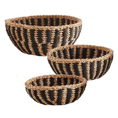 small, medium, and large round rattan baskets with black stripes.