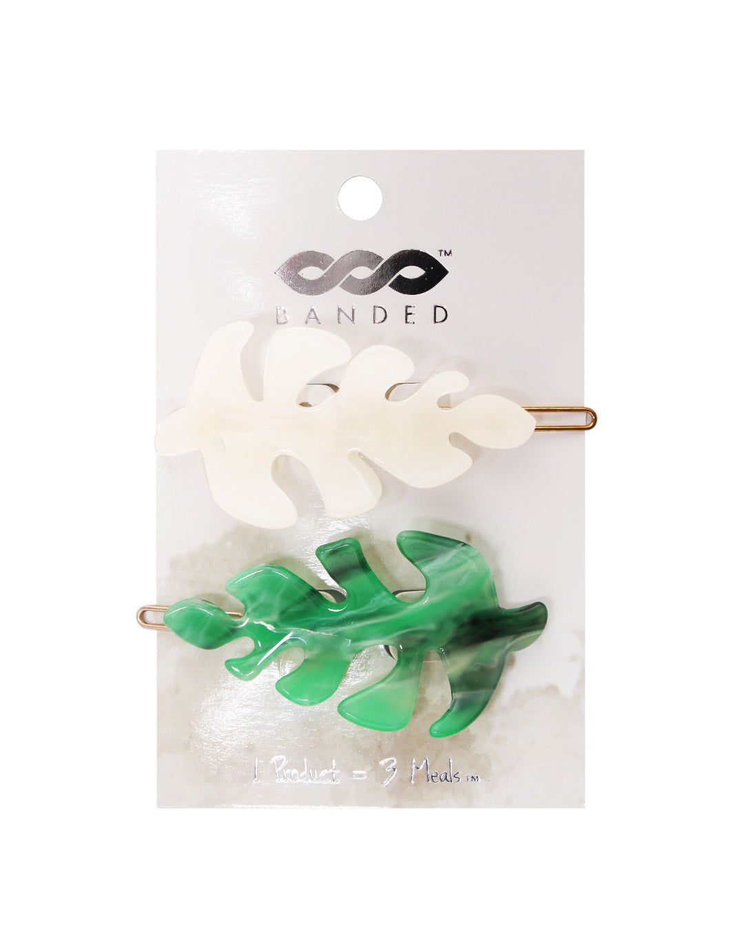 white and green unbeleafable acrylic barrettes displayed on hanging card against a white background