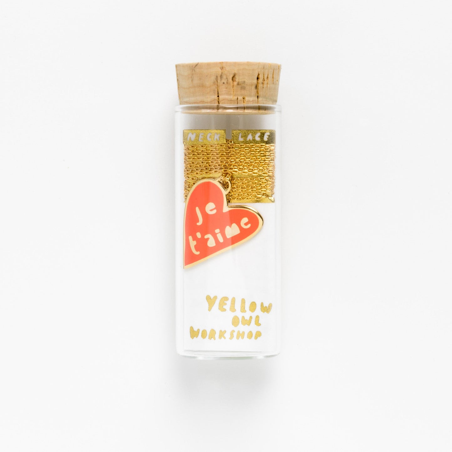 necklace shown in glass vile packaging on white background.