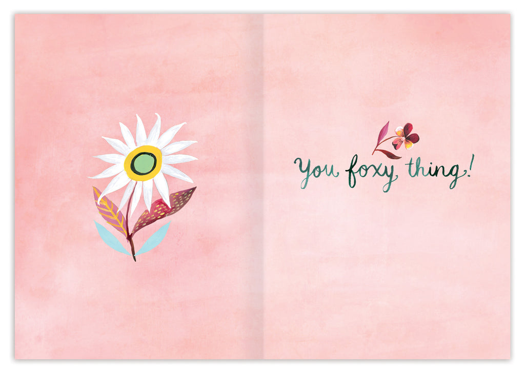 inside of card is pale pink and has a white flower on one side and text listed in the description