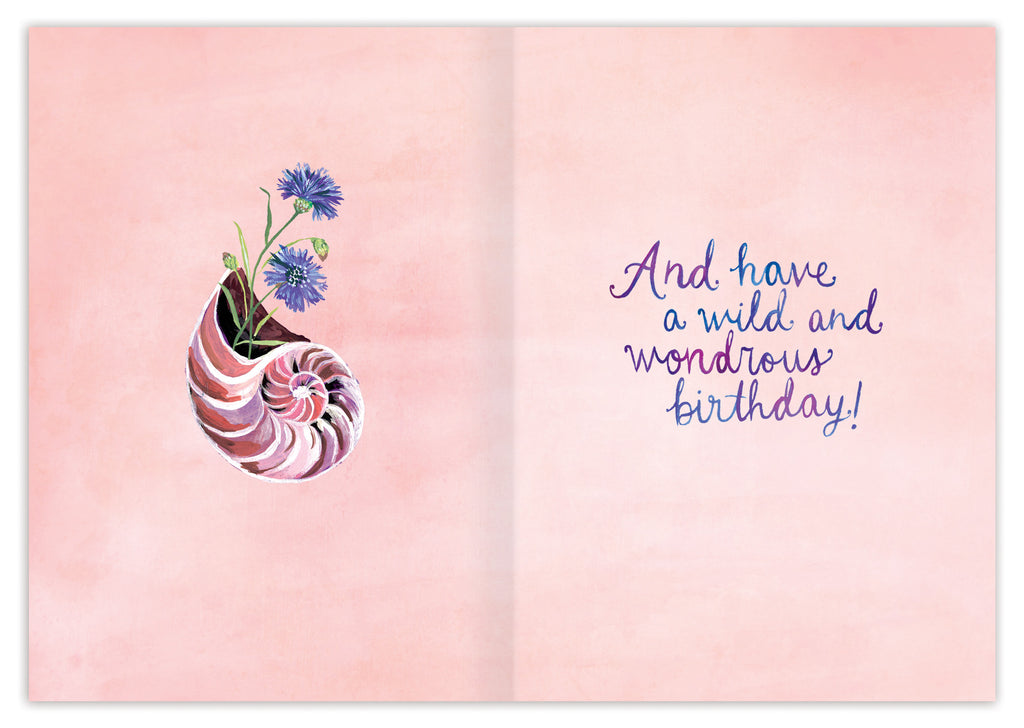 inside view of card is pink with a shell that has a purple flower growing out of it and the other side has text listed in the description