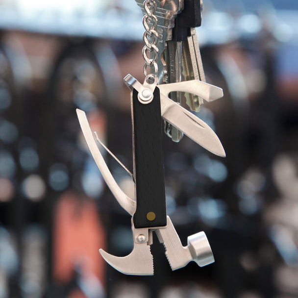 wood mini hammer tool displayed on a set of keys