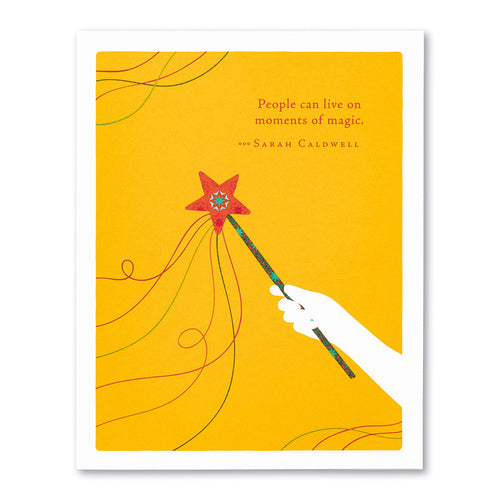 front is a hand holding a star wand with text