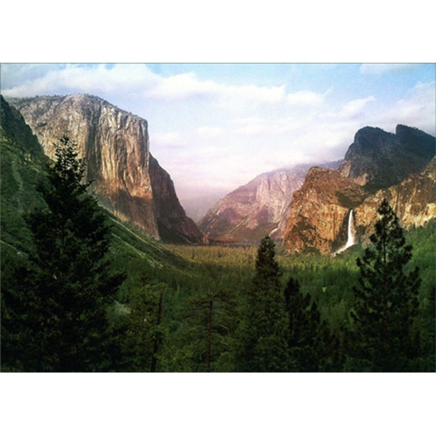 front of card is a photograph of mountains and a waterfall