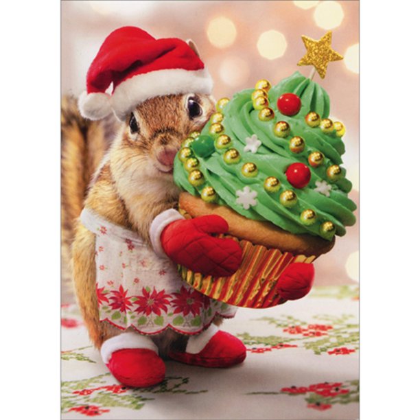 christmas card with a chipmunk holding a christmas tree cupcake while wearing the santa hat and apron on a white background
